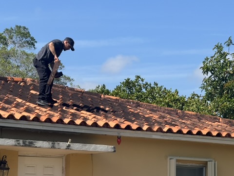 Jorge Garcia performing a full home inspection on a South Florida tile-roof home